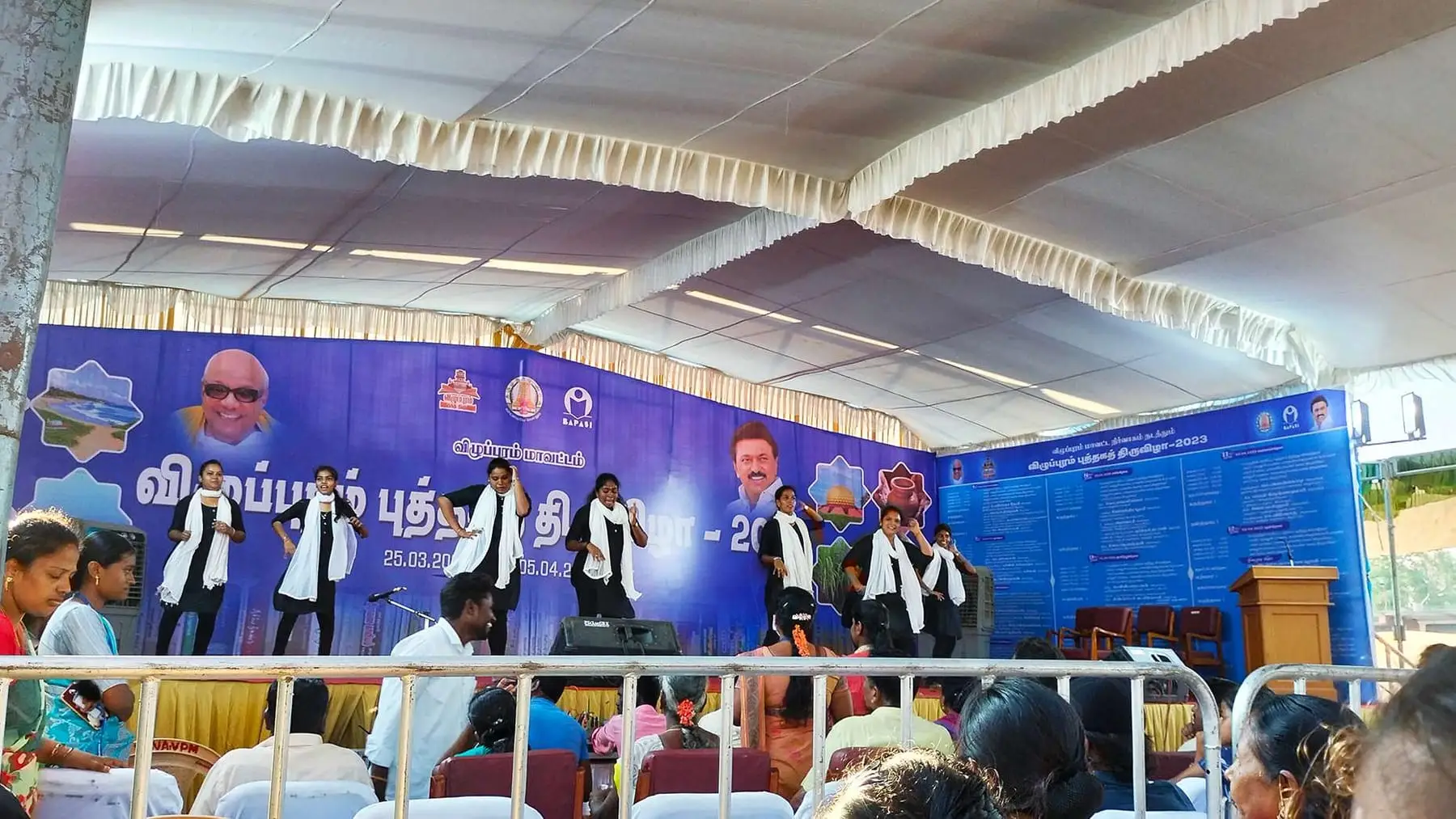 Students perform a dance on the stage of the Villupuram book fair.